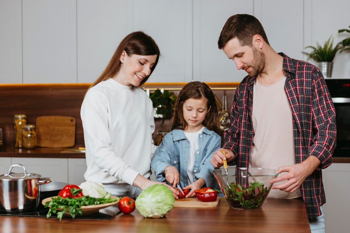 front-view-family-preparing-food-kitchen-home_23-2148804998